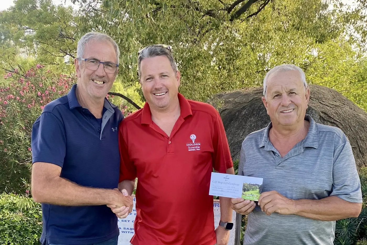 Darce Whinam congratulates NTP winner Ryan Terry and Seniors leader Ian Tierney.