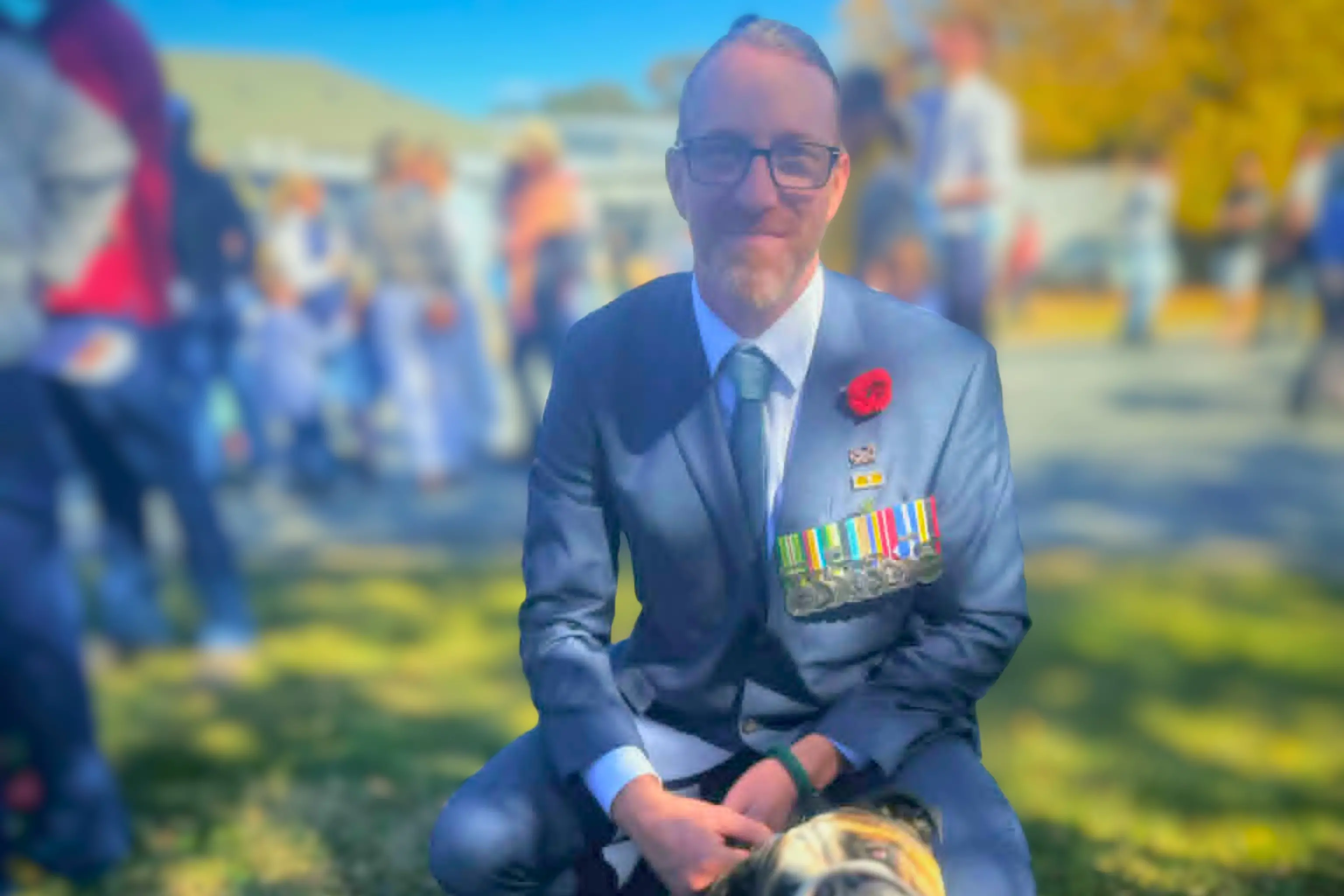 <p>Mike Armstrong, guest speaker with his dog Squish at the Boorowa ANZAC Day ceremony</p>\\n
