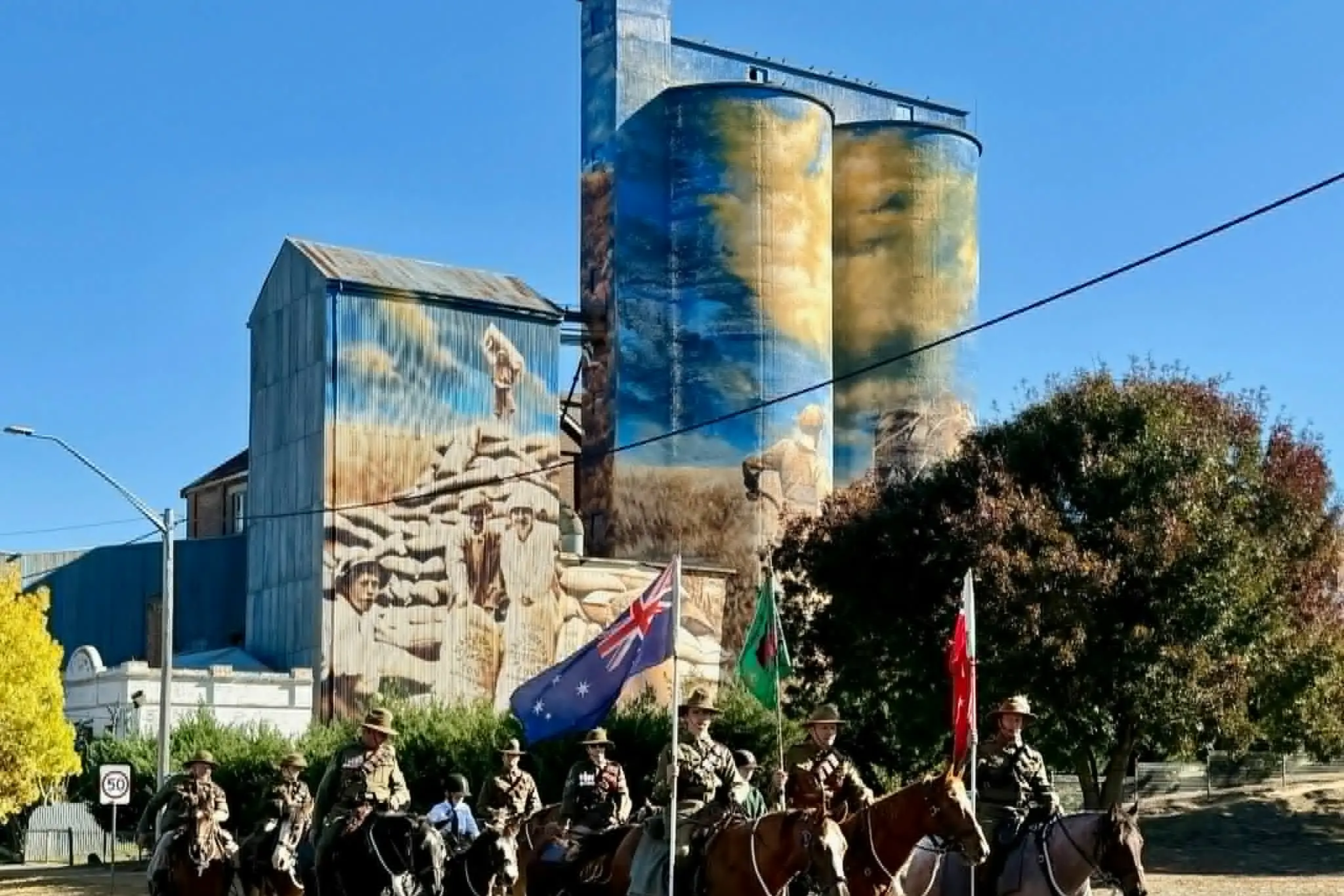 <p>The Lighthorse Brigade marching  with silo behind. PHOTO: Supplied</p>\\n