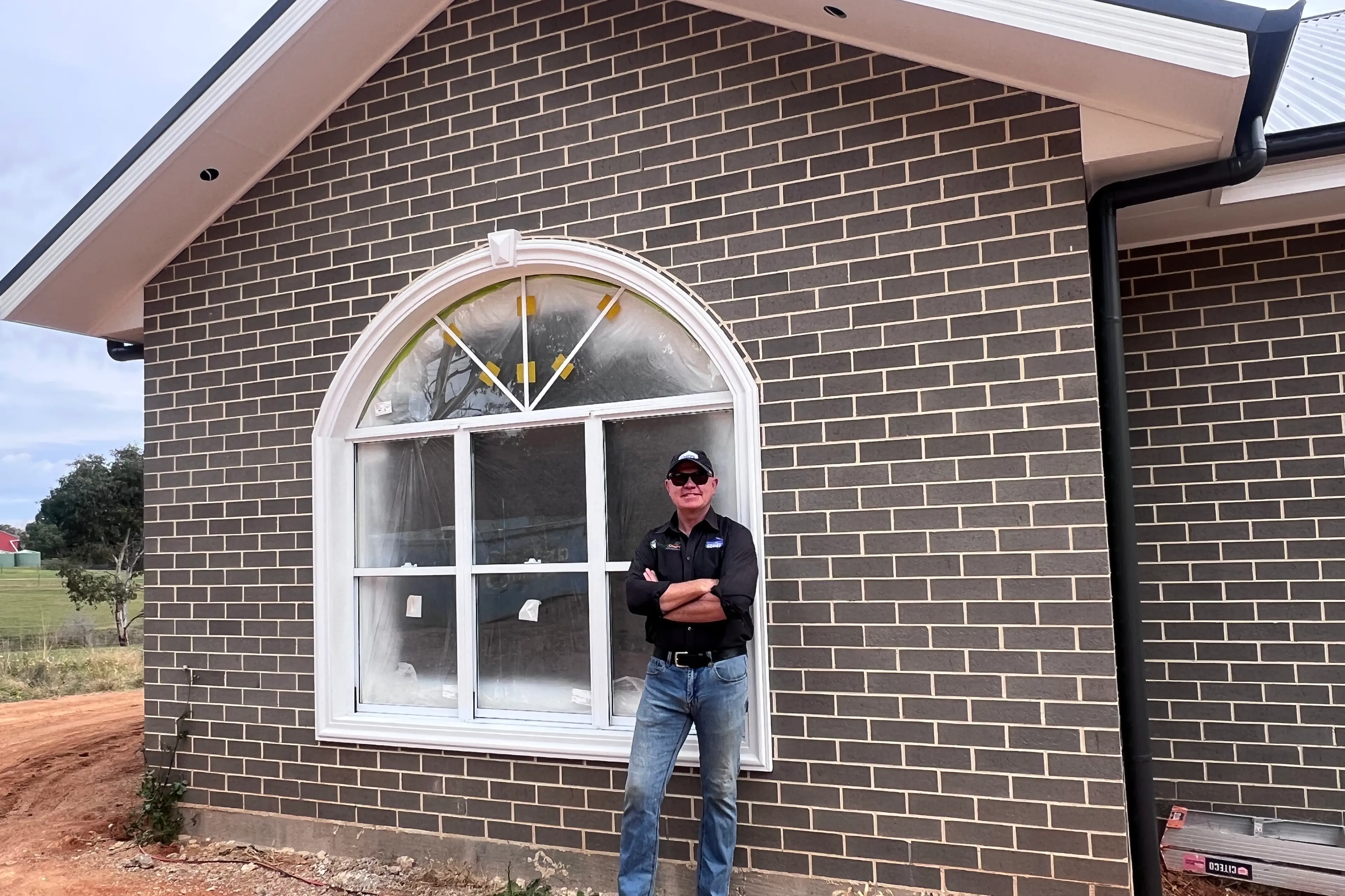 <p>Steadfast Homes owner Scott Lacey hard at work on his current building project.</p>\\n