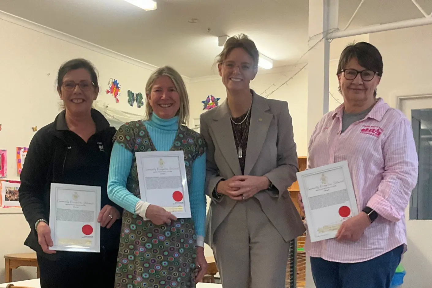<p>Long-serving Young Preschool and Kindergarten educators were recognised for their combined 82 years of service, with Angie Milne and Regina Cant marking 25 years each and Lynne Smith marking 32 years ahead of retirement. They are pictured with Member for Cootamundra Steph Cooke. PHOTO: Supplied by Young Preschool and Kindergarten </p>\\n