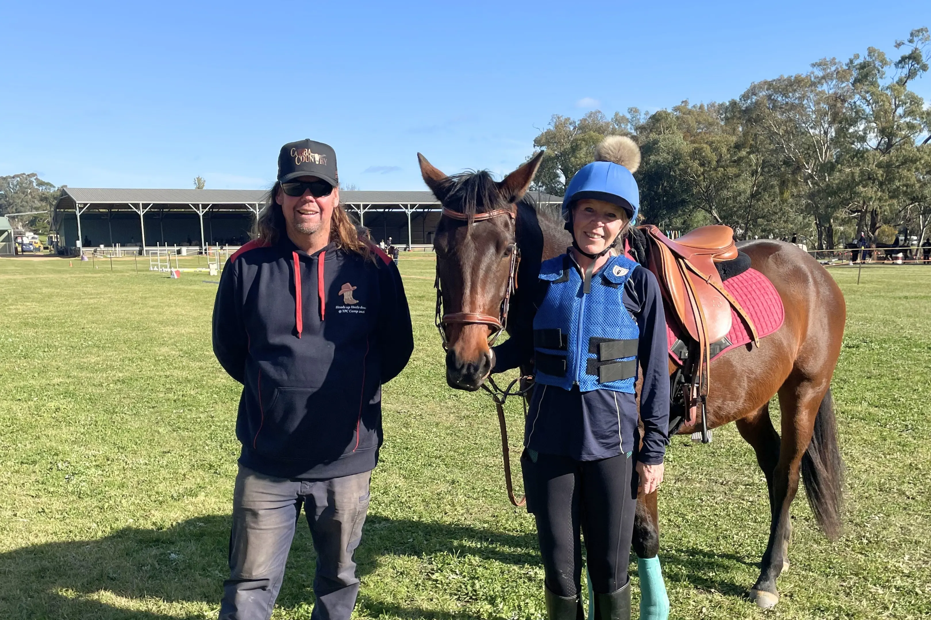 <p>Young Pony Club President Barry Matthews and Group Coordinator Naomi Ritchie at camp on Tuesday, proud to see another year come together after many hours of work behind the scenes.</p>\\n