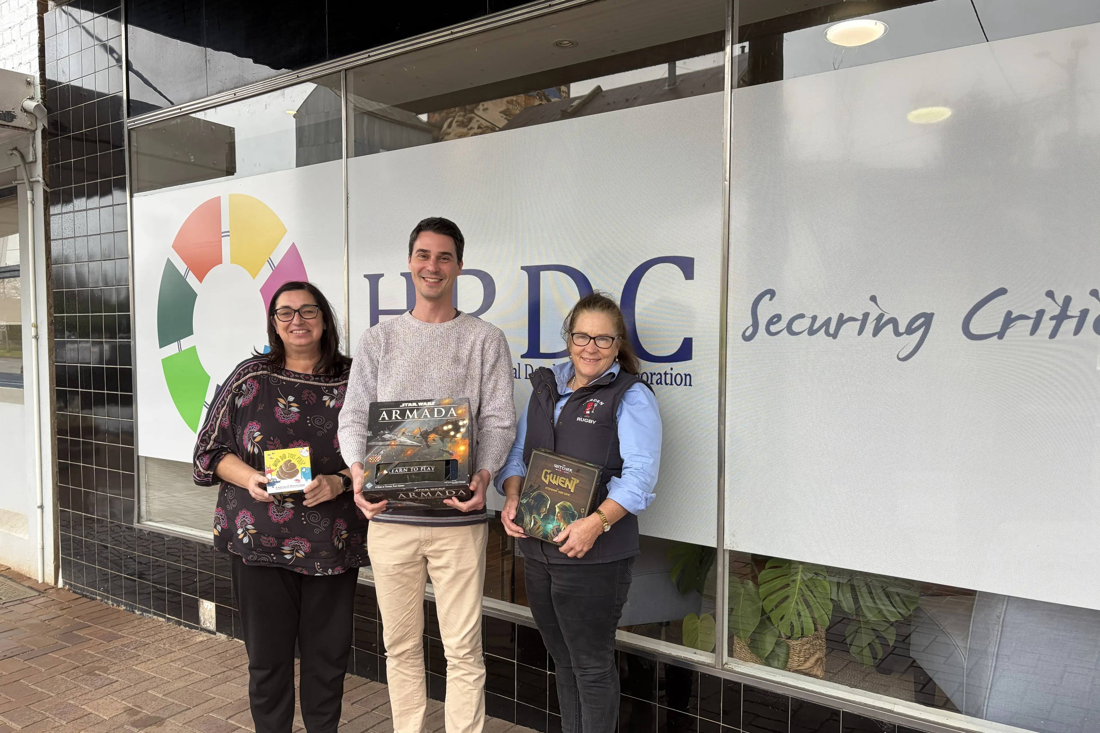 <p>HRDC\\'s Melissa Pinney, Murrumburrah High School teacher Matt Gilbert, and Antonia Brown celebrating one of HRDC\\u2019s recent projects \\u2013 Harden Hangouts. PHOTO: Supplied</p>\\n