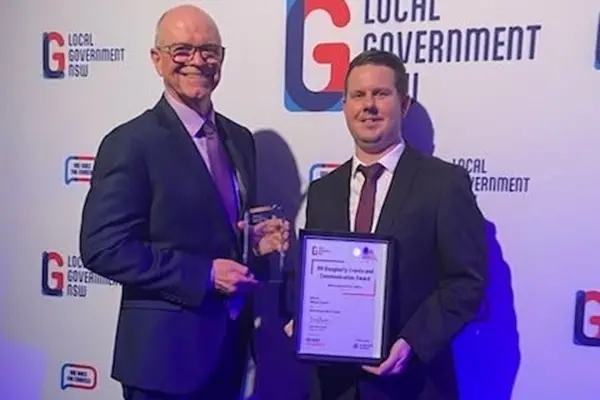 <p>Gerard Dunn, Acting Director Corporate and Community, and Dave Munnerley, Tourism and Events Coordinator accepted the RH Dougherty Award on behalf of Council. PHOTO: Hilltops Council\\'s Facebook </p>\\n