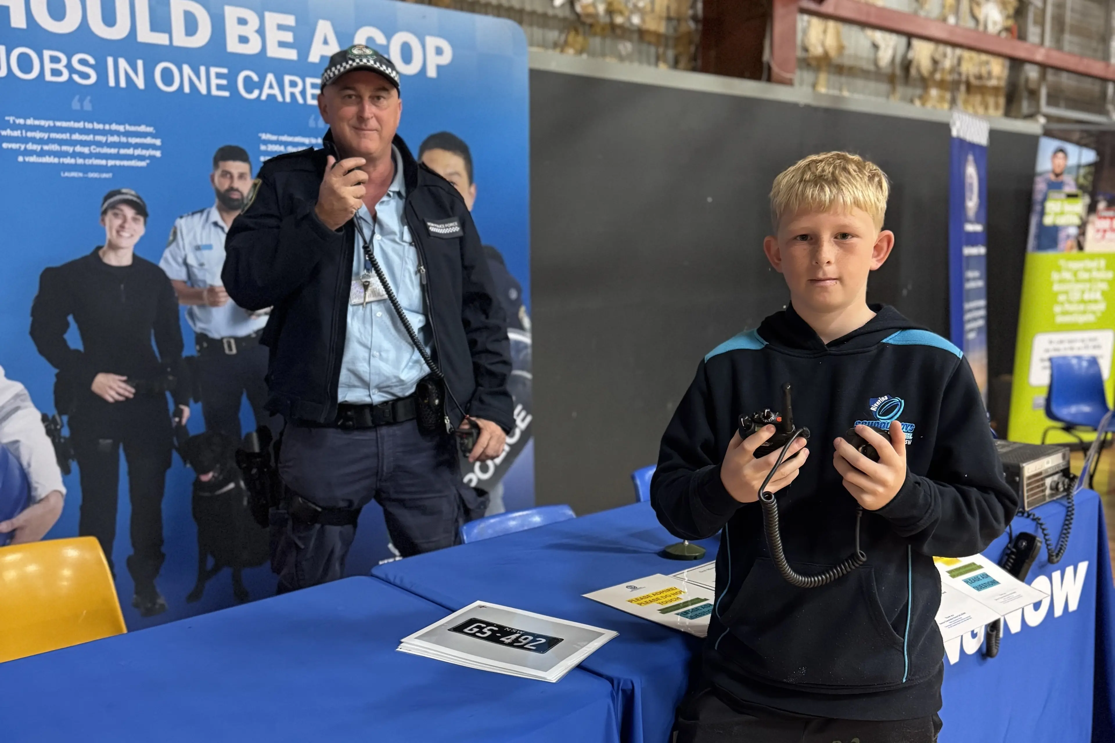 <p>A potential future cadet with an old head from the radio network team. PHOTO: Ryan Long</p>\\n