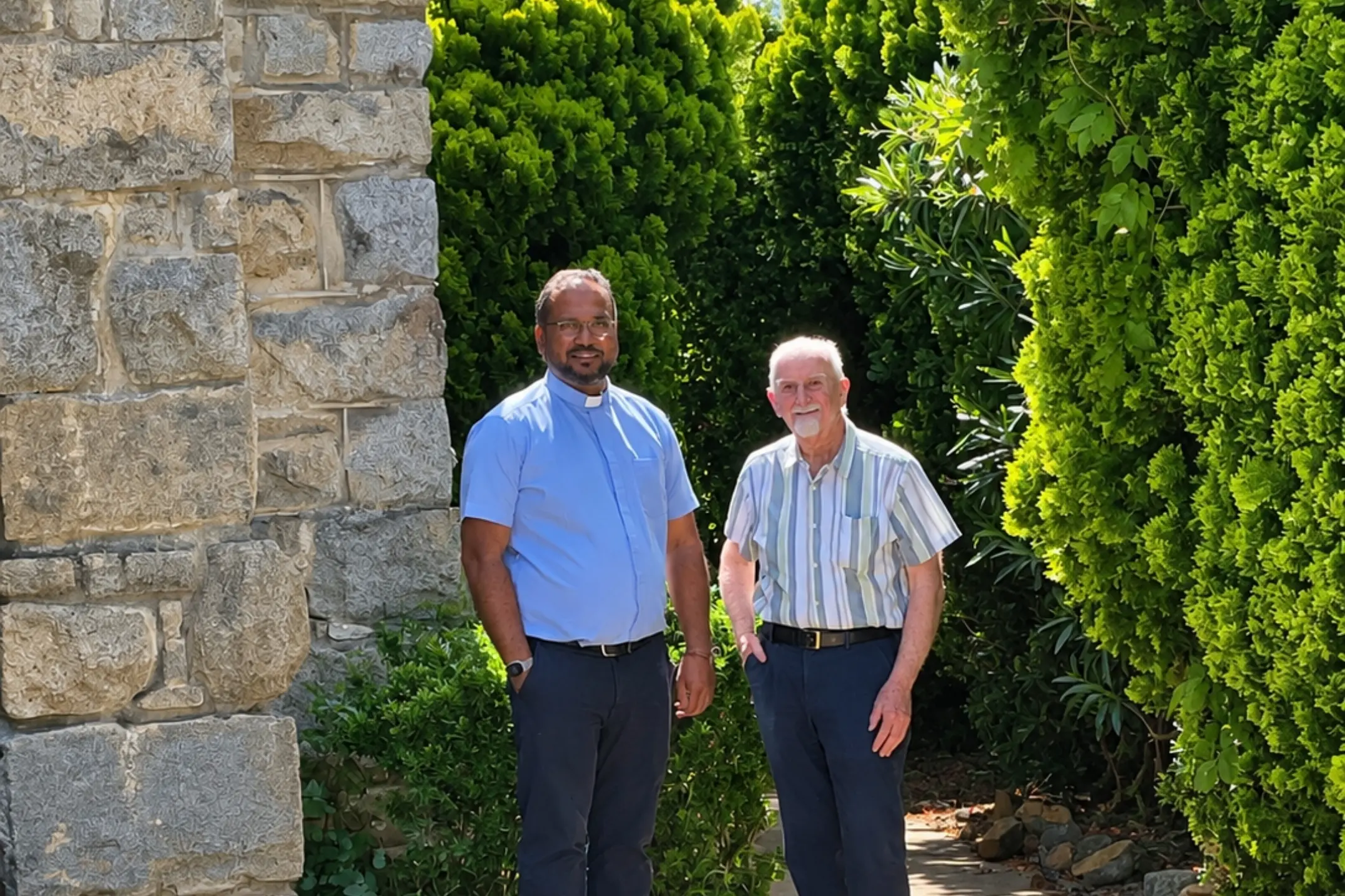 <p>Parish priest Fr Rofin Raphel IV Dei (left) and Fr Allen Crowe beside St Mary\\'s Catholic Church in Young. </p>\\n